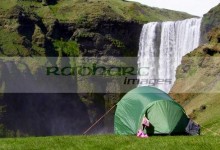 small two person tent with clothes drying camping at skogafoss waterfall iceland