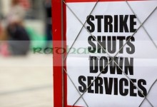 strike shuts down services newspaper headline