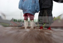 children walking through flooded streets