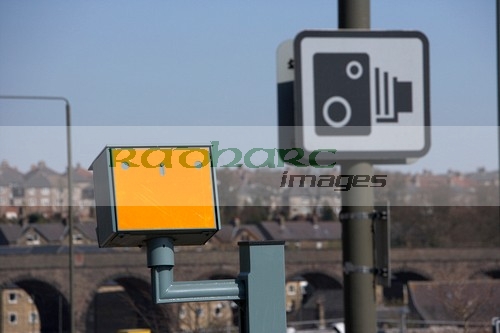 speed traffic camera and warning sign