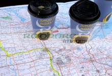 two coffee cups map of the midwestern states of the usa with route planned in highlighter on the car hood