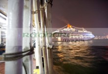 star ferry passing behind large star cruises cruise ship in busy victoria harbour hong kong hksar china asia - deliberate motion blur