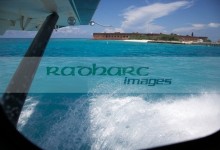 looking out of seaplane window landing on the water next to fort jefferson garden key dry tortugas florida keys usa